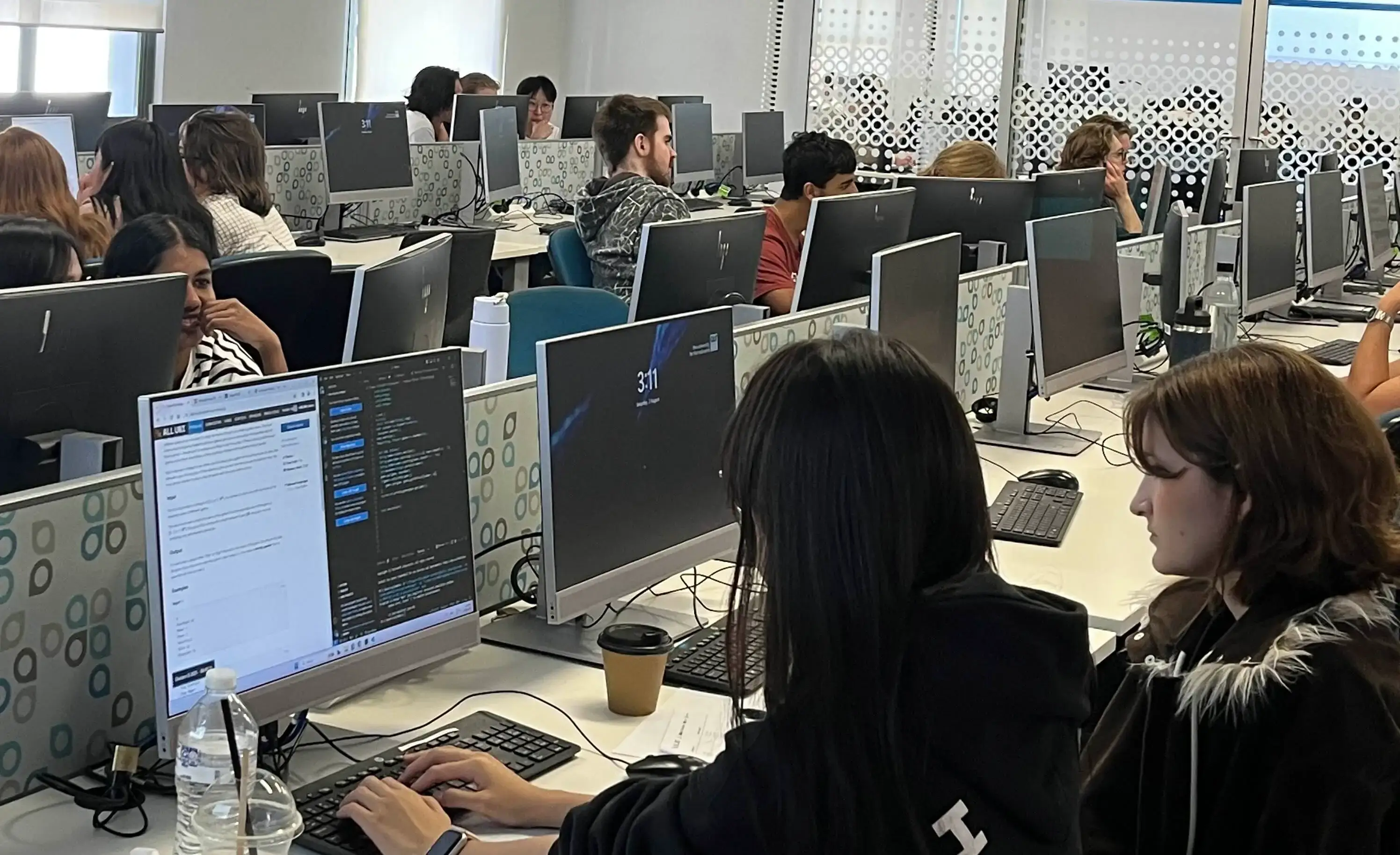 Students in a computer lab competing in a contest